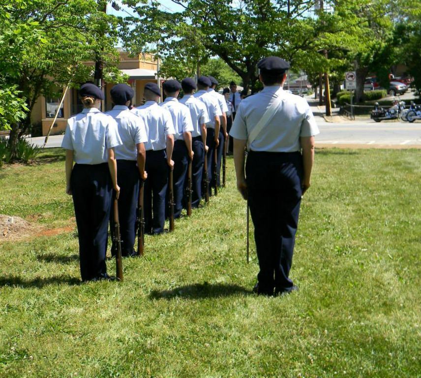 Servicemembers in line, standing at attention
