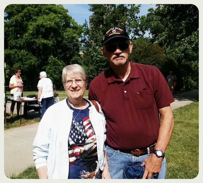 Man and woman standing and smiling