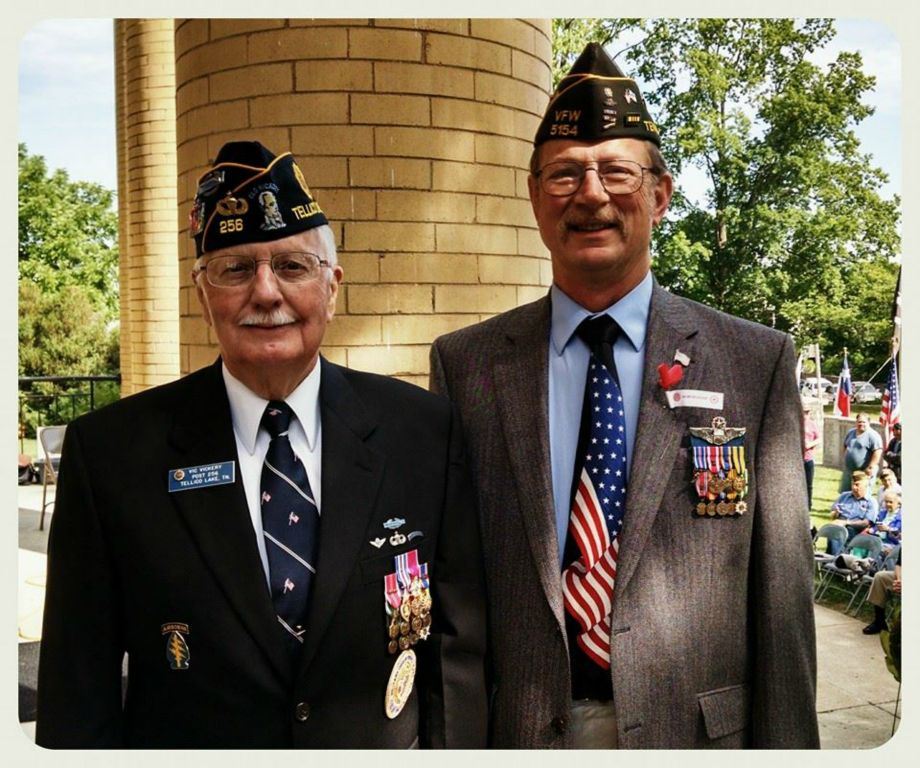 Two men in suit with military decorations