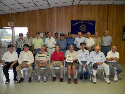 Veterans sitting and standing in a group