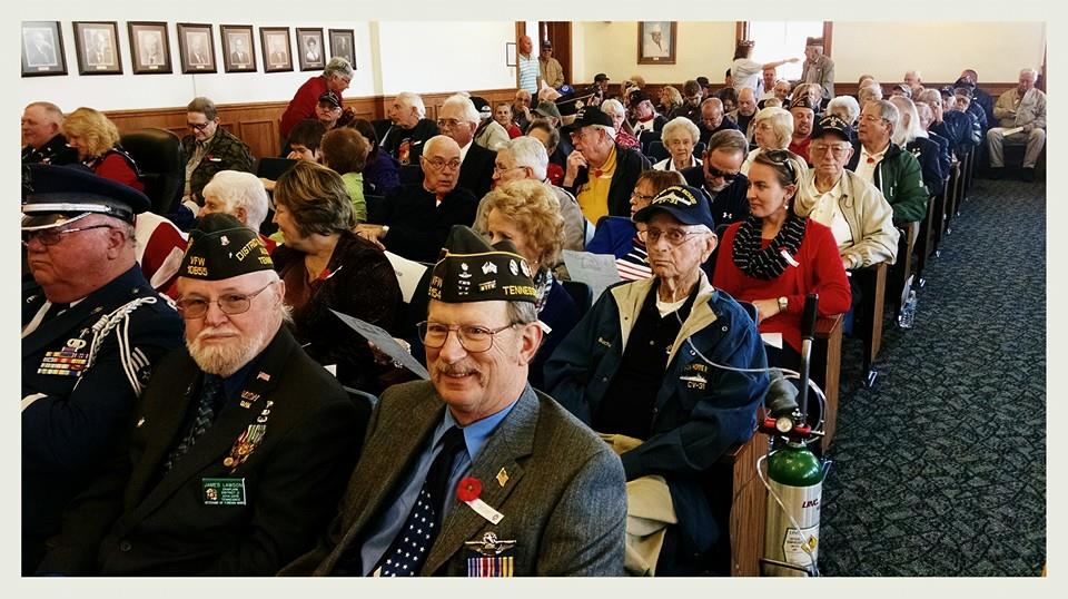 Image of audience sitting inside court house room