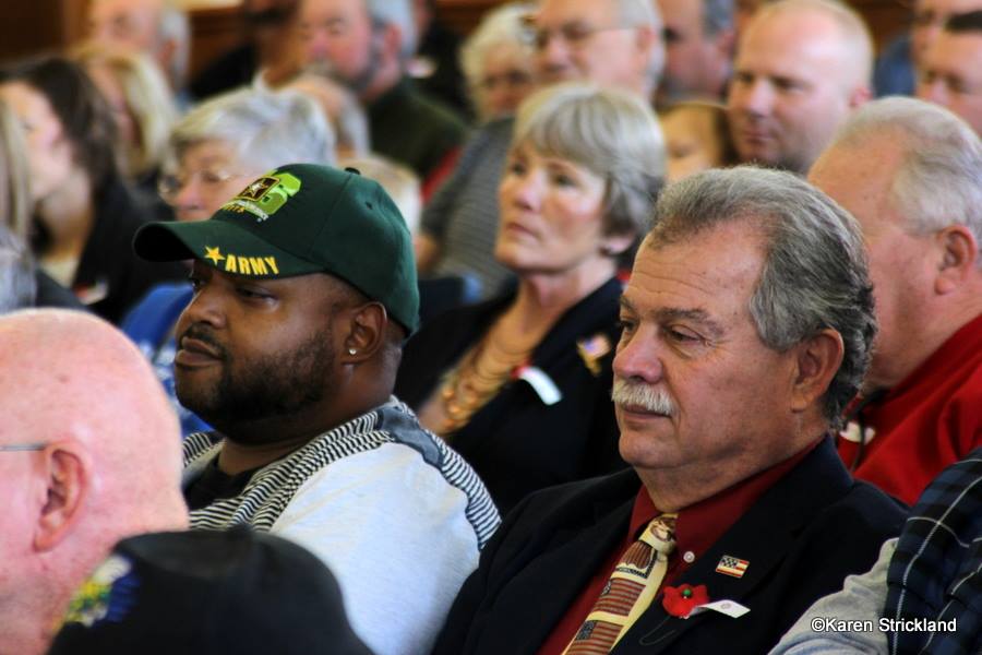 Up close of memebers of the audience, side view