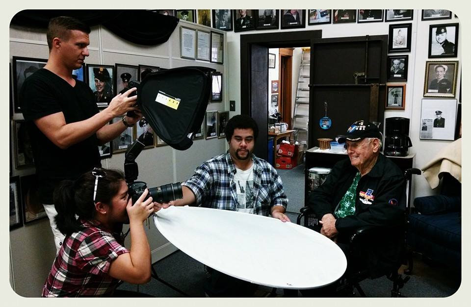 Picture of camera people taking portrait of veteran
